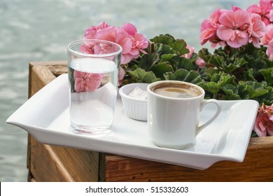 Turkish Coffee (greek Coffee) Served With A Glass Of Water By Sea