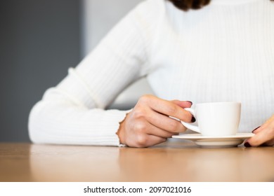 Turkish Coffee On Cup, Woman Hand. Cafe Background