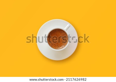 Turkish coffee on yellow background.