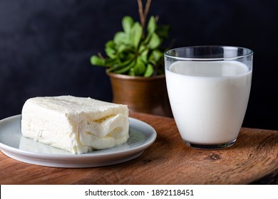 Turkish creamy dairy product. Clotted cream (butter cream) for Turkish breakfast with glass of milk. - Shutterstock ID 1892118451