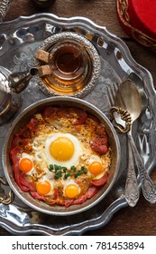 Turkish Cured Beef And Fried Eggs In Copper Pan, Traditional Breakfast, Top View