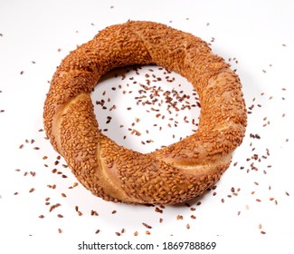 Turkish delicios traditional bagel simit with sesame on white wooden rustic background, turkish breakfast pastry concept simit