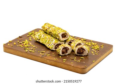 Turkish Delight with Pistachio. Turkish delight with chocolate filling, isolated on a white background. Traditional Turkish cuisine delicacies. close up