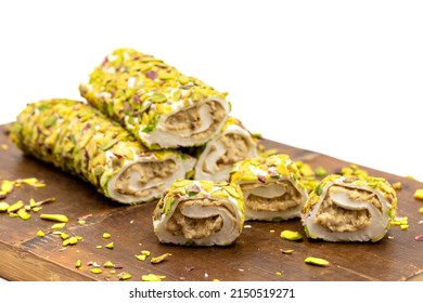 Turkish Delight with Pistachio. Turkish delight with cream filling, isolated on a white background. Traditional Turkish cuisine delicacies. close up