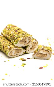 Turkish Delight with Pistachio. Turkish delight with cream filling, isolated on a white background. Traditional Turkish cuisine delicacies. close up