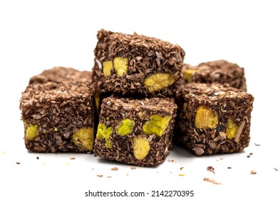 Turkish Delight with Pistachio isolated on a white background. Turkish Delight with Coconut Grain on it and Pistachio inside. Close-up. Traditional Turkish cuisine delicacies.