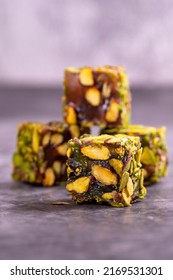 Turkish Delight with Pistachio on a dark background. Traditional Turkish delicacies. Turkish Delight with Apple Flavored Pistachio. close up - Shutterstock ID 2169531301