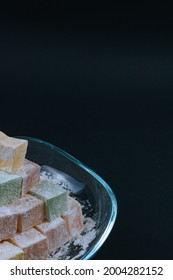 Turkish Delights In A Glass Bowl Isolated On Black Background. Kurban Bayrami (eid Al Adha), Ramazan Bayrami (eid Al Fitr) Story Background Photo. Iyi Bayramlar - Eid Mubarak