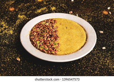 Turkish dessert kunefe, kunafa, kadayif with pistachio powder and cheese hot eaten a sweet - Shutterstock ID 1396547573