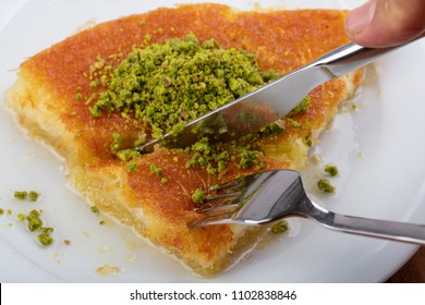 turkish dessert kunefe , slide with pistachio powder