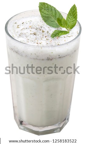 Turkish Drink Ayran or Kefir with fresh herbs in a glass. Buttermilk made with yogurt. isolated white background