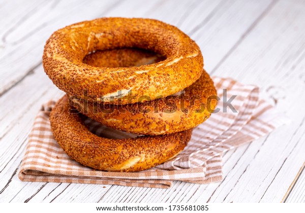 Turkish fast\
food bagel called Simit. Turkish bagel Simit with sesame. Bagel is\
traditional Turkish bakery\
food.
