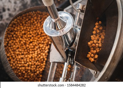 Turkish fast food. Roasting appetizing pea chickpeas in a shiny retro vending machine on the street. - Powered by Shutterstock