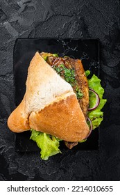 Turkish Fish Sandwich With Grilled Mackerel Fillet Balik Ekmek. Black Background. Top View.