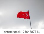 Turkish Flag on cloudy sky background.