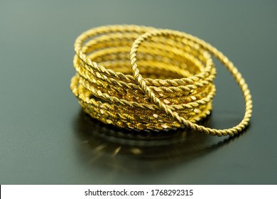 Turkish Gold 24 Carat On Dark Ground. Macro Shooting