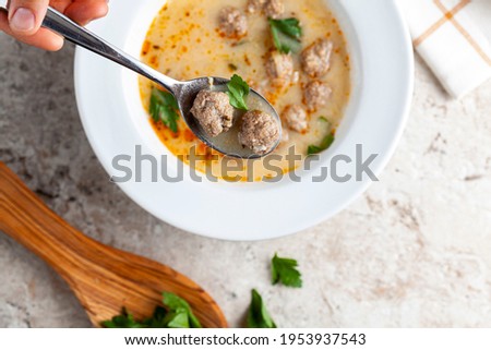 Turkish meatball soup (Terbiyeli kofte corbasi ) is a popular dish in Turkey where meatballs made with ground beef and rice are cooked in broth with egg mix and herbs and served hot with spices.