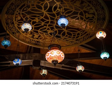 turkish mosaic lamps in a dark room - Shutterstock ID 2174073191