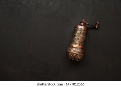 Turkish Pepper Mill Or Grinder On Dark Wooden Background. Top View. Copy Space