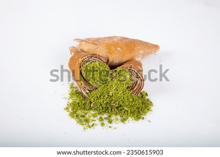 Turkish pestil amulet with pistachio. (Gaziantep Muska - Fistik Muskasi). Traditional amulet fruit pulp prepared with a mixture of grape molasses and flour and adding walnuts or pistachios.