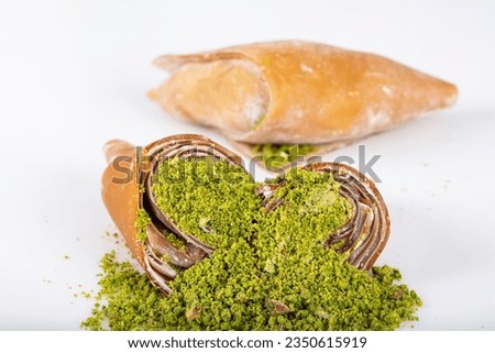Turkish pestil amulet with pistachio. (Gaziantep Muska - Fistik Muskasi). Traditional amulet fruit pulp prepared with a mixture of grape molasses and flour and adding walnuts or pistachios.