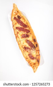 Turkish pide with bacon on white background.  