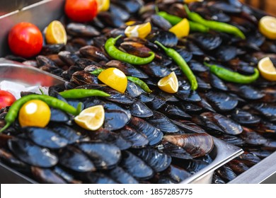 Turkish Style Appetizer Street Food Stuffed Mussels Called Midye Dolma On Bench For Sale With Lemon Which Is Served With A Squirt Of Lemon Juice In Istanbul, Turkey.