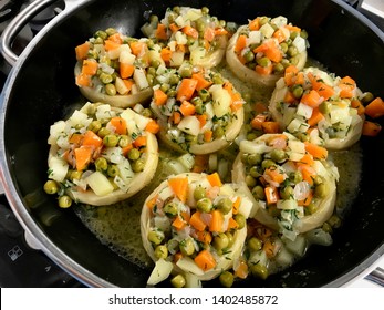 Turkish Style Olive Oil Artichokes with Green Peas, Carrot and Potato Slices.