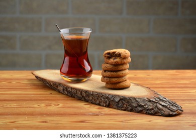 Turkish Tea And Cookies On The Brown Wooden Table In The Studio