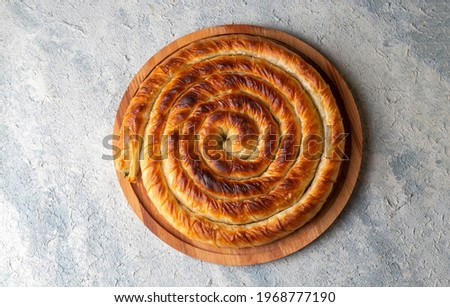 Turkish Tepsi Boregi, Round Borek, Tray pastry  (Turkish name; rulo borek) Stock fotó © 