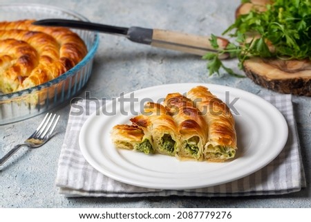 Turkish Tepsi Boregi, Round Borek, Tray pastry (Turkish name; rulo borek - ispanakli borek) Stock fotó © 