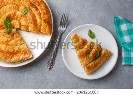 Turkish Tepsi Boregi, Round Borek, Tray pastry (Turkish name; rulo borek - ispanakli borek) Stock fotó © 