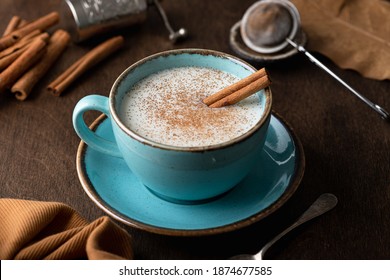 Turkish traditional hot drink salep on wooden background, selective focus