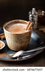 Turkish traditional hot drink salep on wooden background, selective focus