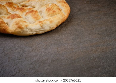 Turkish Traditional Pita Bread On Stone Surface. Round Flat Bread On Dark Textured Table Surface. Copy Space