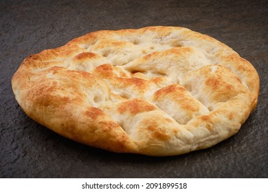 Turkish Traditional Pita Bread On Stone Surface. Round Flat Bread On Dark Textured Table Surface