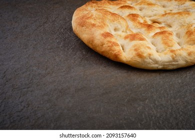 Turkish Traditional Pita Bread On Stone Surface. Round Flat Bread On Dark Textured Table Surface