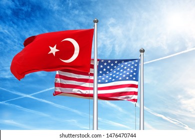 Turkish And Usa National Flag Waving Against Cloud Blue Sky Side View Of Natural Color Republic Of Turkey And Of United States Of America Us State Symbols Isolated For Design Copy Space Template