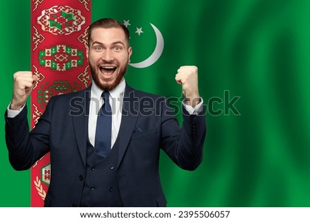 Turkmen happy businessman on the background of flag of Turkmenistan Business, education, degree and citizenship concept