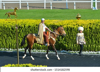 TURKMENISTAN, ASHGABAT - APRIL 24,2019: Day Of Turkmen Racehorse. President Gurbanguly Berdimuhamedow On Akhal Teke Horse.