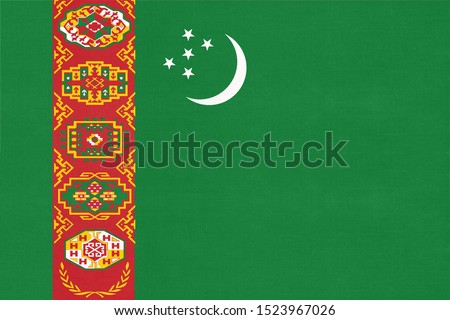Turkmenistan national fabric flag textile background. Symbol of international world Asian country. State official turkmen sign.