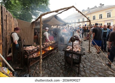 TURKU, ABO FINLAND ON JUNE 29. View of a stand. Food for sale, pork in the Medieval Market on June 29, 2013 in Turku, Abo Finland. Unidentified people. 
