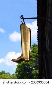 TURKU, ABO FINLAND ON JUNE 30. View, closeup of a metallic boot on a hook. Sign, a symbol for a bootmaker on June 30, 2013 in Turku, Abo Finland.