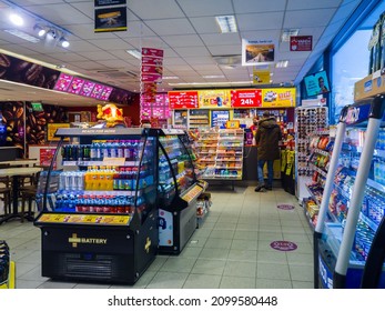 Turku, Finland - December 24, 2021: Horizontal View Of Shell Gas Station Convenience Store Cashier And Customer.