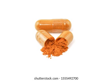 Turmeric (Curcuma longa L.) or Curcuma longa powder with capsule for alternative medicine isolated on white background, Spa products and food ingredient, Herb capsule.