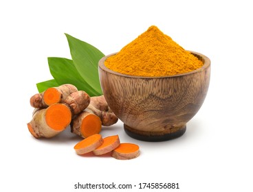 Turmeric (curcumin) Powder In A Wooden Bowl,root And Leaves Isolated On A White Background,For Spice,Is An Herbal Remedy For Flatulence.