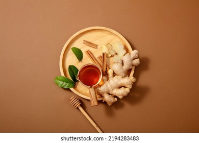 Turmeric ginger tea preparation with healthy ingredients on Brown background, top view.  - Powered by Shutterstock