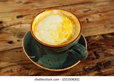 Turmeric latte or golden milk , The drink is made by steaming milk with aromatic turmeric powder and spices