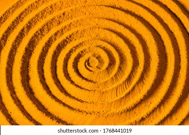 Turmeric powder spirally twisted, close-up image - Powered by Shutterstock