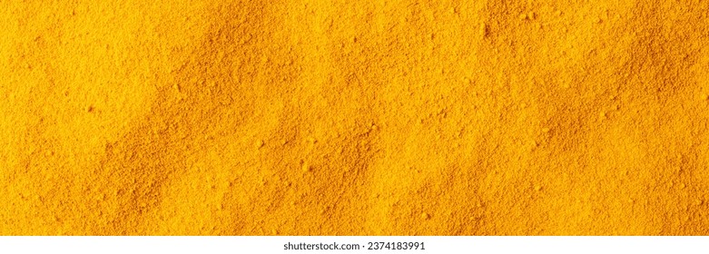 Turmeric powder texture. Background with copyspace. Close up. Top view - Powered by Shutterstock